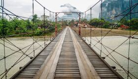 Begin your travel day with Vang Vieng’s serene ambiance